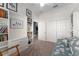 Spacious living area featuring built-in bookshelves, providing ample storage, and a comfortable floral sofa at 1016 Pickering Path, The Villages, FL 32163