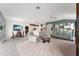 Expansive open-plan living space with neutral walls, offering versatile seating and dining options at 1016 Pickering Path, The Villages, FL 32163