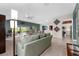 Open living area with great light, leading to the dining area and the kitchen at 1016 Pickering Path, The Villages, FL 32163
