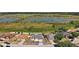 Aerial view of property with backyard lake and home's location at 1017 Bluegrass Dr, Groveland, FL 34736