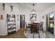 A dining room with hardwood floors, table with four chairs, and sliding glass doors at 1017 Bluegrass Dr, Groveland, FL 34736