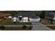 Charming single-story home with well-manicured lawn, concrete driveway, and a two-car garage at 1017 Bluegrass Dr, Groveland, FL 34736