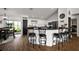 Kitchen area with breakfast bar, stainless steel appliances and pantry door at 1017 Bluegrass Dr, Groveland, FL 34736