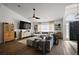 Comfortable living room featuring hard wood floors, a gray sofa, and tasteful decorations at 1017 Bluegrass Dr, Groveland, FL 34736