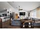 Spacious living room with vaulted ceiling, open to kitchen, offering comfortable living space at 1017 Bluegrass Dr, Groveland, FL 34736