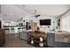 Open-concept living room and kitchen layout with modern finishes at 1017 Bluegrass Dr, Groveland, FL 34736
