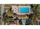 Aerial view showcasing the community pool, recreation areas, and lush landscaping in a serene neighborhood setting at 10301 Us Highway 27 # 63, Clermont, FL 34711