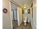 Bathroom features a toilet, and gray wood-look floors at 10301 Us Highway 27 # 63, Clermont, FL 34711