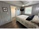 Bedroom features a bed, ceiling fan, TV, and gray walls at 10301 Us Highway 27 # 63, Clermont, FL 34711
