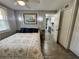 Bedroom features a bed, ceiling fan, and gray walls at 10301 Us Highway 27 # 63, Clermont, FL 34711