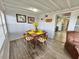 Charming dining area with seating for four and an abundance of natural light and a view to the Kitchen at 10301 Us Highway 27 # 63, Clermont, FL 34711