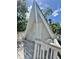 Charming A-frame cabin with a wooden deck and a cozy, inviting entrance, perfect for relaxing outdoors at 10301 Us Highway 27 # 63, Clermont, FL 34711