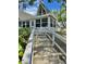 Charming home featuring inviting front steps that lead to the entrance, with lush greenery at 10301 Us Highway 27 # 63, Clermont, FL 34711