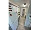 Galley kitchen featuring white appliances, granite countertops, and gray wood-look floors at 10301 Us Highway 27 # 63, Clermont, FL 34711