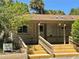 Onsite laundromat for convenience, featuring multiple mailboxes, covered entrance and steps at 10301 Us Highway 27 # 63, Clermont, FL 34711