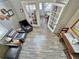 Bright living room features an open doorway and hardwood floors at 10301 Us Highway 27 # 63, Clermont, FL 34711