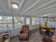 Bright and airy living area filled with natural light, showcasing a comfortable seating area with a view of the outside at 10301 Us Highway 27 # 63, Clermont, FL 34711