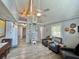 A charming interior features a spiral staircase, loft area, wood look flooring, and plenty of natural light at 10301 Us Highway 27 # 63, Clermont, FL 34711