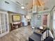 Bright living area with spiral staircase, modern flooring, and a cozy loft at 10301 Us Highway 27 # 63, Clermont, FL 34711