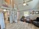 Living space features spiral staircase, with a loft area above and stylish wood-look flooring at 10301 Us Highway 27 # 63, Clermont, FL 34711