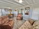 Inviting living room combining dining and lounge spaces with lots of natural light and comfortable seating for entertaining at 10301 Us Highway 27 # 63, Clermont, FL 34711