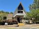 Attractive recreation hall with striking A-frame, large window and covered entrance at 10301 Us Highway 27 # 63, Clermont, FL 34711