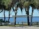 Vacation Village entrance sign with scenic water view, inviting residents and guests to enjoy the lake at 10301 Us Highway 27 # 63, Clermont, FL 34711