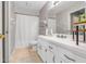 Bathroom with a white vanity, shower with curtain, and a tiled floor at 10640 Parkway Dr, Clermont, FL 34711