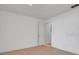 Cozy bedroom with carpeted floors, neutral colors, and a standard door at 10640 Parkway Dr, Clermont, FL 34711