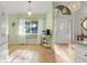 Bright dining area features light green walls, a window, and tile floors at 10640 Parkway Dr, Clermont, FL 34711