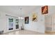 Bright dining room with french doors and walls decorated with vintage posters at 10640 Parkway Dr, Clermont, FL 34711