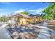 Well-maintained one-story home with a side entry garage, complemented by neat landscaping and a concrete walkway at 10640 Parkway Dr, Clermont, FL 34711