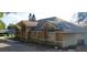 Side view of a well-maintained single story home with a landscaped yard at 10640 Parkway Dr, Clermont, FL 34711