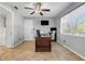 Home office featuring natural light from a window and a ceiling fan at 10640 Parkway Dr, Clermont, FL 34711