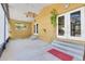 Enclosed patio with ceiling fan, steps to doors, and neutral flooring at 10640 Parkway Dr, Clermont, FL 34711