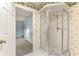Bathroom featuring a glass shower, accessible from the adjacent bedroom at 10683 Se 174Th Loop, Summerfield, FL 34491