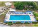Inviting community pool in Spruce Creek with lounge chairs and a relaxing atmosphere at 10683 Se 174Th Loop, Summerfield, FL 34491