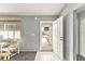 Bright foyer with tile flooring, neutral walls, and decorative storm door view at 10683 Se 174Th Loop, Summerfield, FL 34491