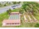 Aerial view of community shuffleboard courts with covered seating and parking at 10683 Se 174Th Loop, Summerfield, FL 34491