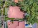Aerial view showcases this home's roof, surrounded by lush greenery and mature trees within a fenced yard at 1164 E Winged Foot Cir, Winter Springs, FL 32708