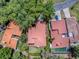 An aerial view of the property highlighting its well-maintained roof, surrounded by trees and landscaping at 1164 E Winged Foot Cir, Winter Springs, FL 32708