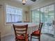 Bright breakfast nook with windows, sliding glass doors to the lanai, and tile flooring at 1164 E Winged Foot Cir, Winter Springs, FL 32708