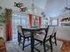 Elegant dining room featuring a modern chandelier and sliding doors to the outside at 1164 E Winged Foot Cir, Winter Springs, FL 32708