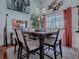 Elegant dining room featuring a modern chandelier and sliding doors to the outside at 1164 E Winged Foot Cir, Winter Springs, FL 32708