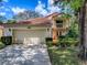Charming two-story home features a two-car garage, balcony and beautiful landscaping at 1164 E Winged Foot Cir, Winter Springs, FL 32708
