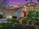 Charming two-story home features a two-car garage, balcony and beautiful landscaping at 1164 E Winged Foot Cir, Winter Springs, FL 32708
