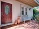 Inviting front porch with seating and decor, creating a warm and welcoming entrance at 1164 E Winged Foot Cir, Winter Springs, FL 32708