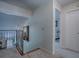 Hallway showing a decorative railing, modern lighting, and views into adjacent rooms at 1164 E Winged Foot Cir, Winter Springs, FL 32708