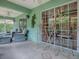 Screened lanai showcasing outdoor seating and tropical accents, perfect for relaxing at 1164 E Winged Foot Cir, Winter Springs, FL 32708