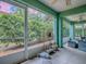 Covered lanai with tiled flooring showcasing outdoor views and comfortable seating at 1164 E Winged Foot Cir, Winter Springs, FL 32708